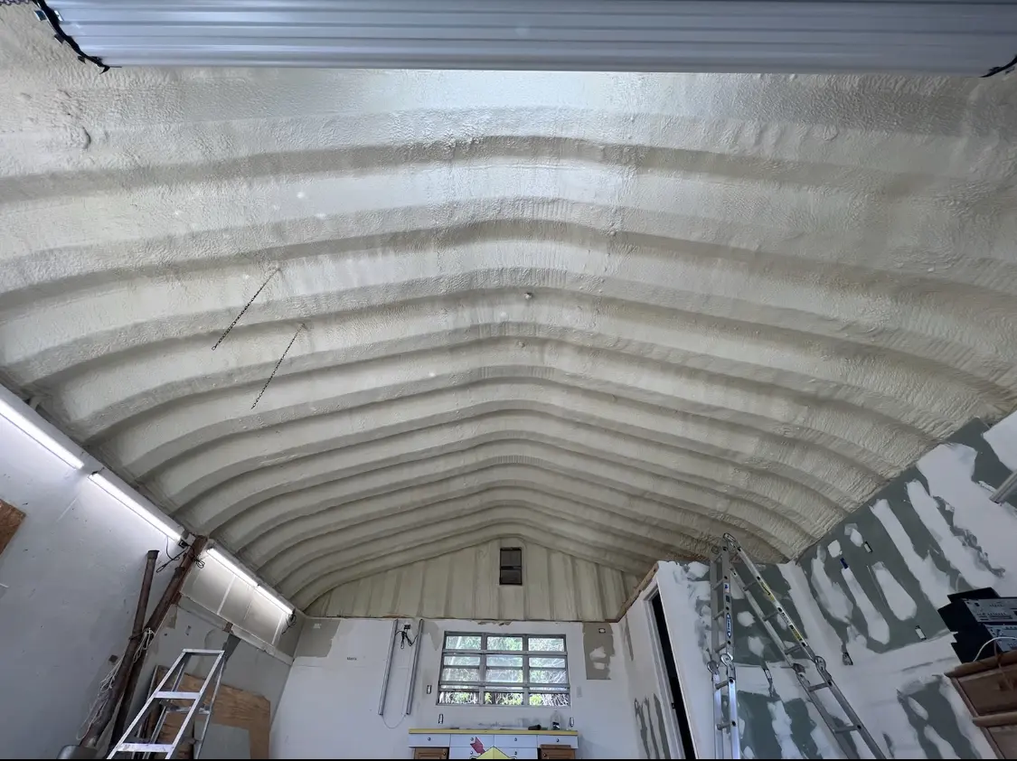 Spray polyurethane foam applied to the underside of a metal roof deck in Mukwonago